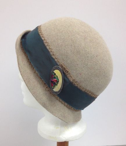 A fur felt hood was blocked to make this cloche for the leading lady in the TV series Damnation.  A vintage ivory brooch decorates the left side.